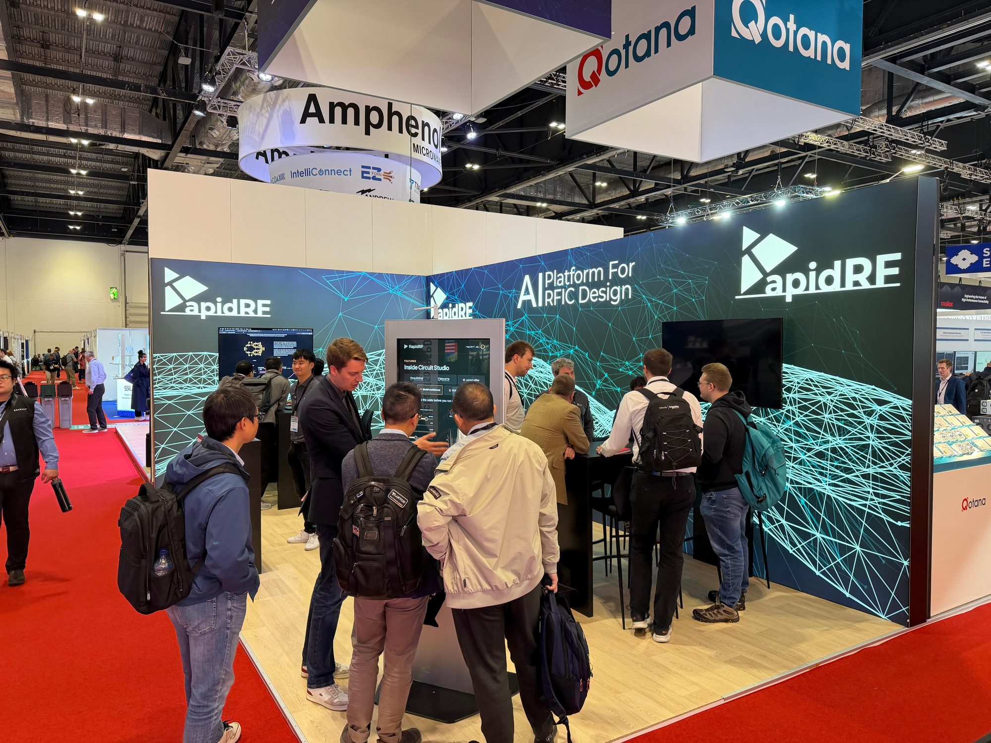 Visitors gathered around the Circuit Studio demo screens at the RapidRF booth